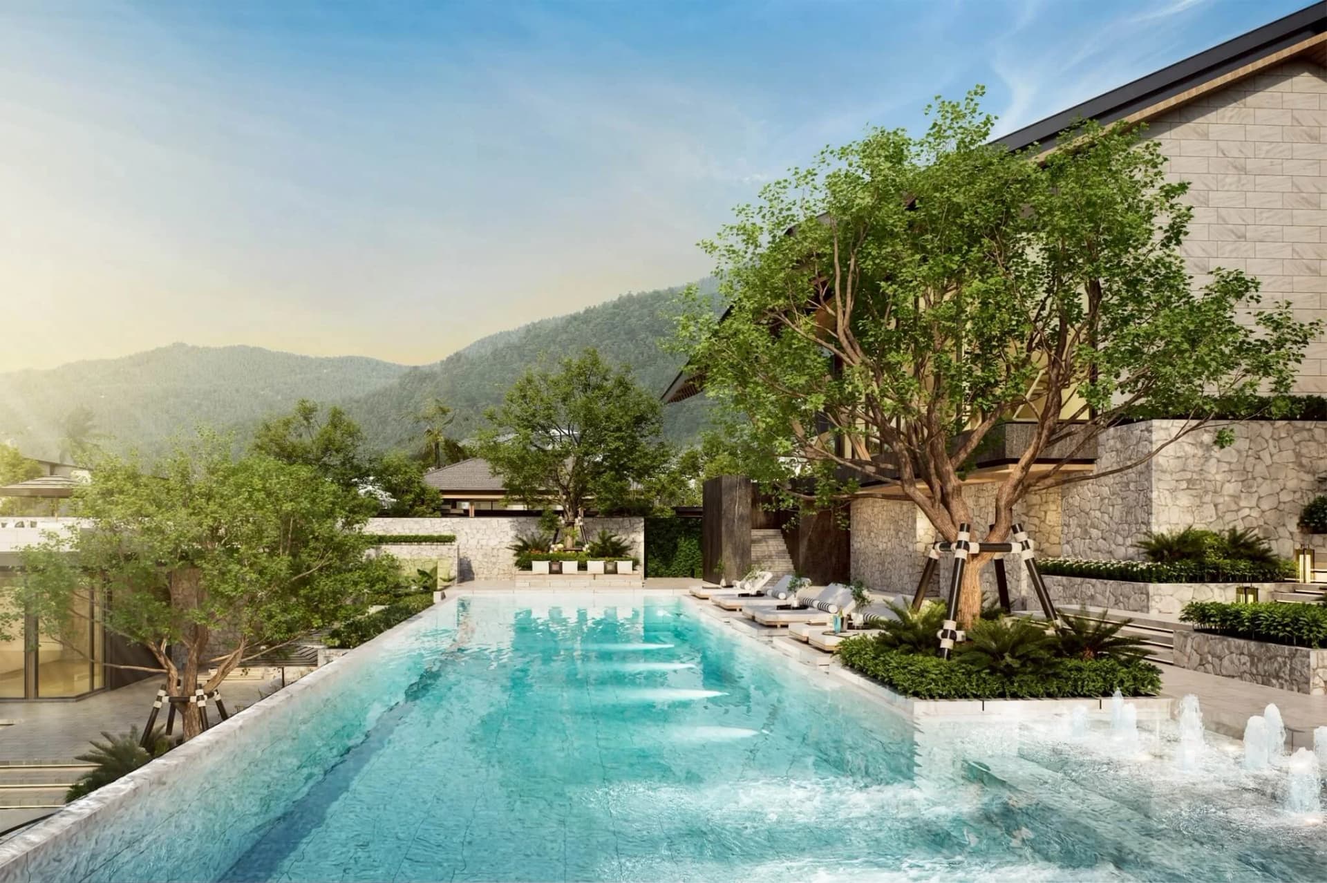 The clubhouse pool with fountain jets and terraced lounge decks, hills behind