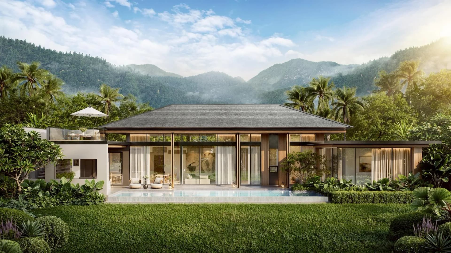 Lyra from the garden: the glazed living wing, the lawn and the private pool